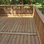 Backyard wooden deck with railing